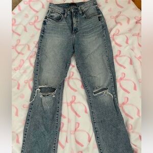 high waisted Silver jeans with knee rips